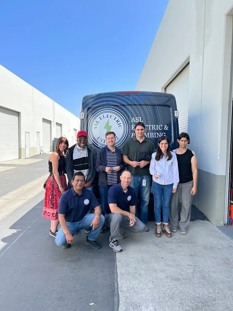 ASL team by the service van
