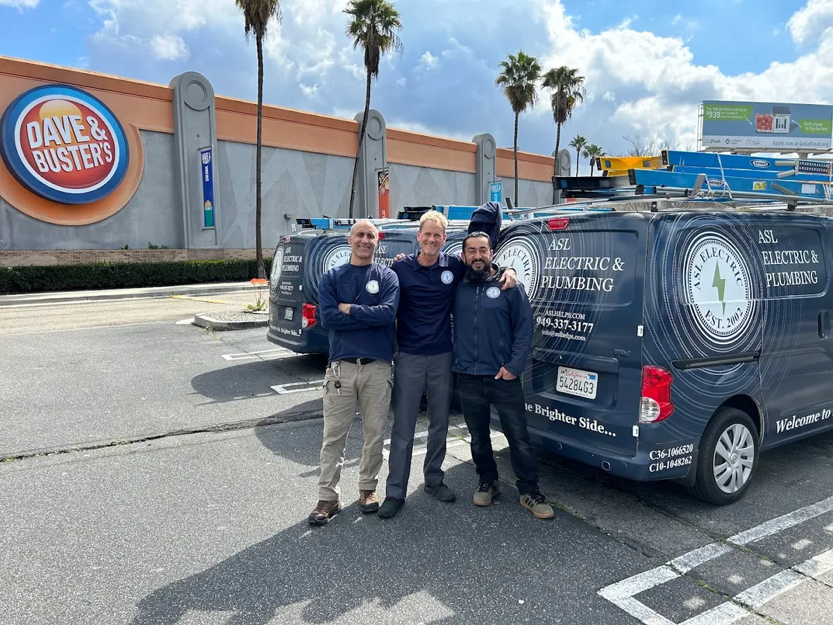 ASL technicians with branded vans